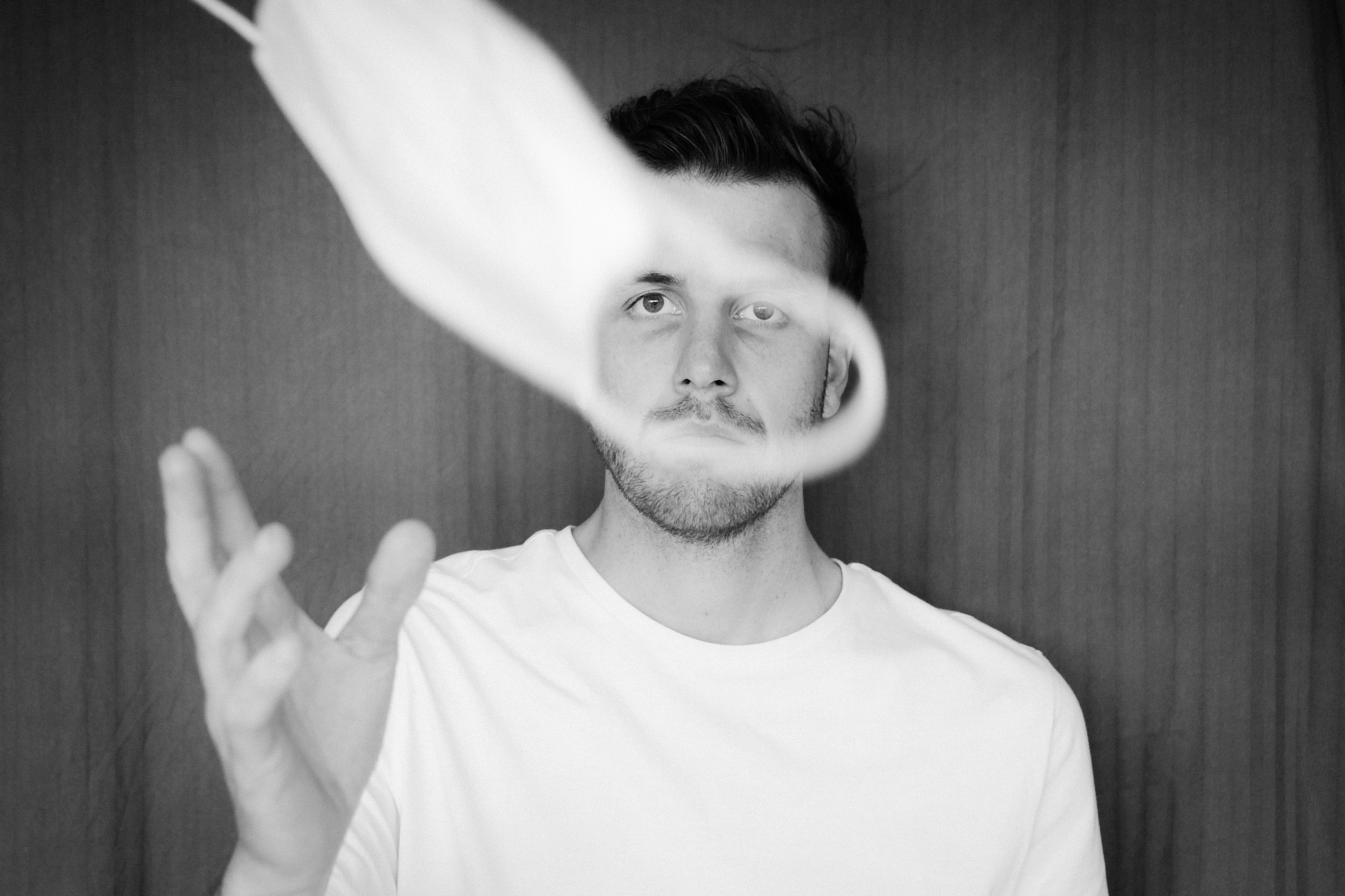 Man Tossing Face Mask