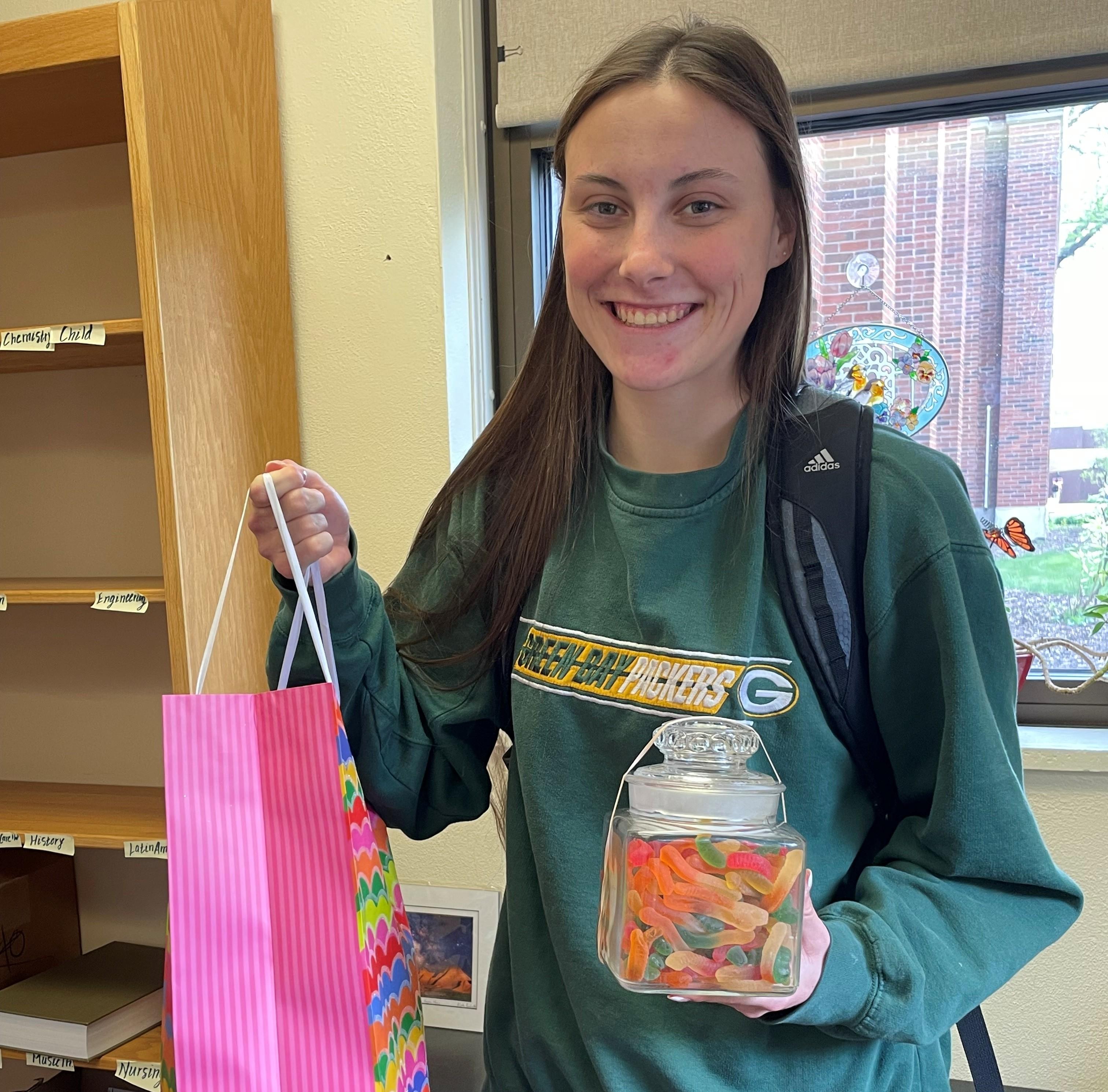 Izzy Jahr holding prizes