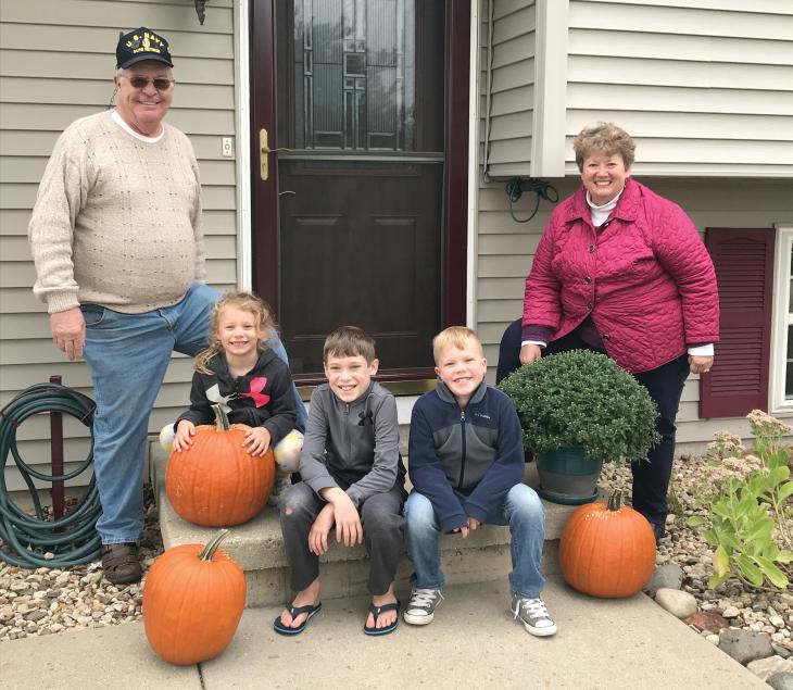 Hesch is pictured with her husband, Paul, and three of their seven grandchildren.