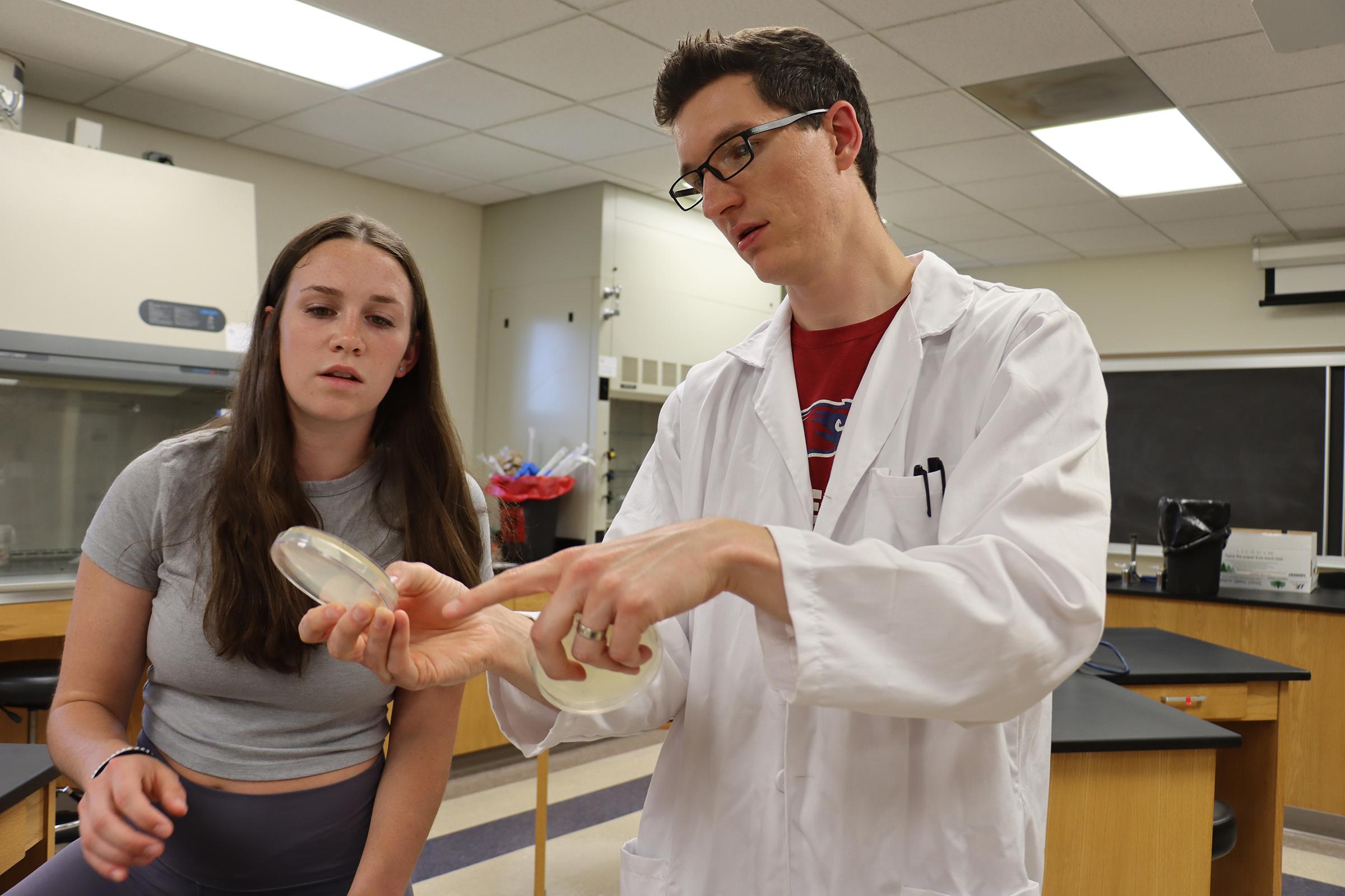 Viterbo University Professor Luke Bussiere and student Emma Schoen