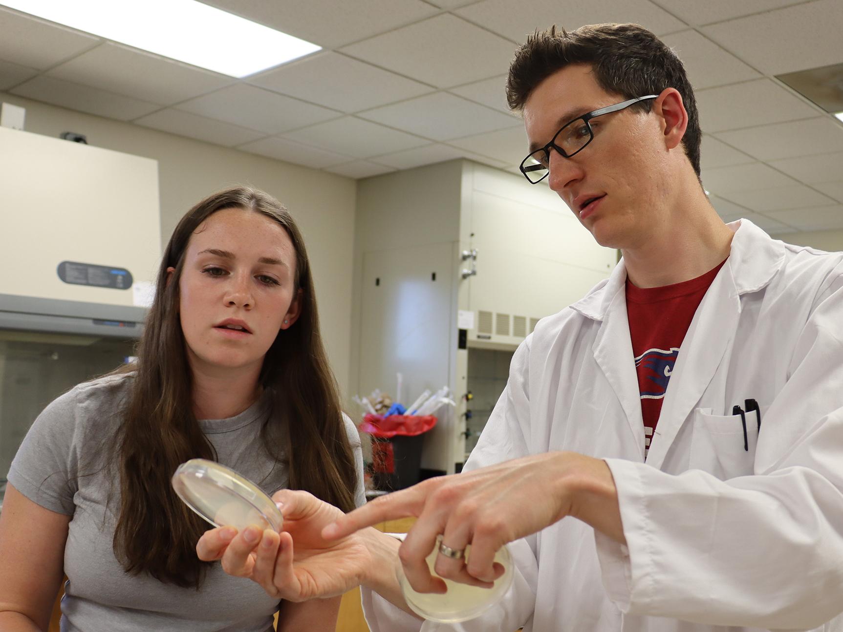 Viterbo University Professor Luke Bussiere and student Emma Schoen