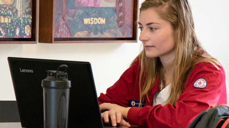 Student nurse at computer