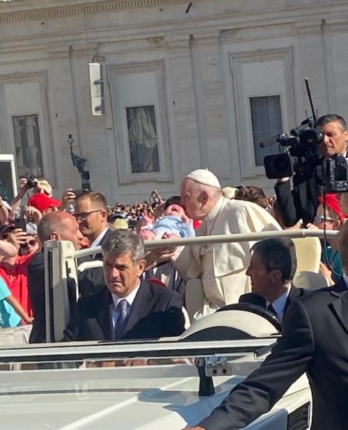 Pope kissing baby