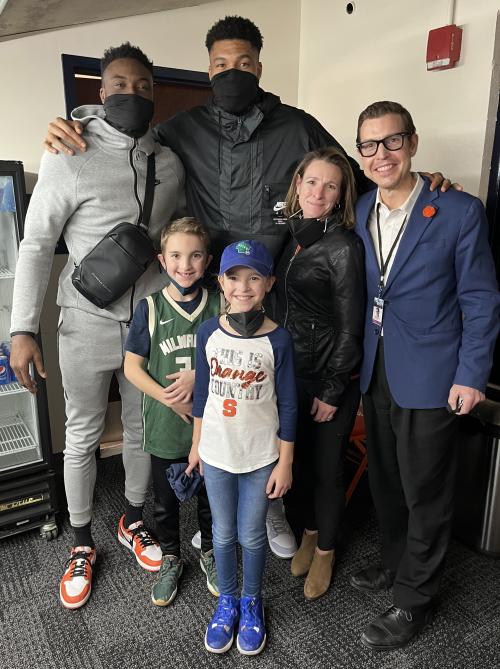 Thanasis Antetokounmpo (far left) and Giannis Antetokounmpo (center) of the Milwaukee Bucks are pictured with Brian, Kristen, Khaya, and Tobi Konkol.