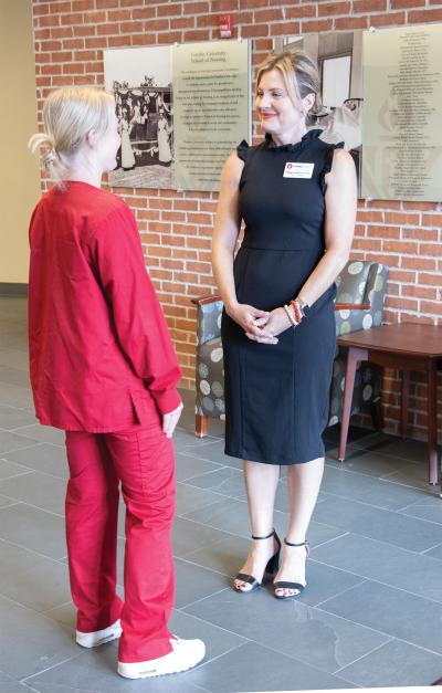 Megan Smith, dean of Viterbo’s College of Nursing and Health, with student