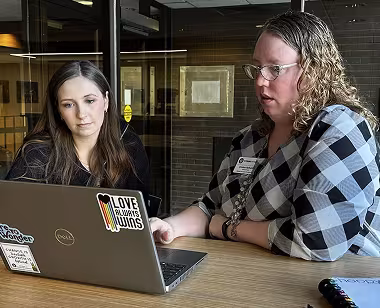 Advisor with student