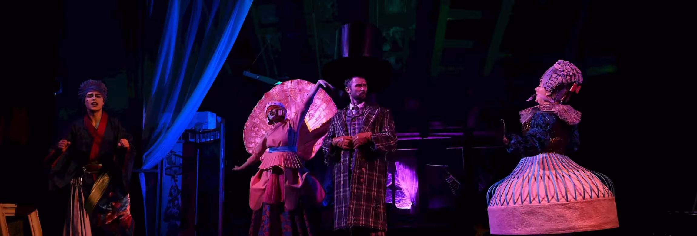 Production image. Four actors on stage