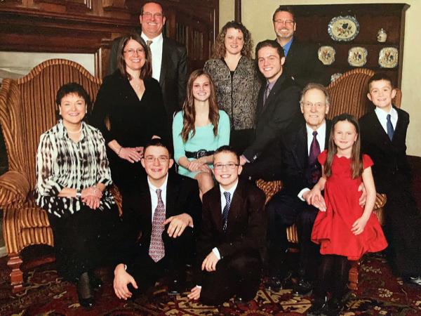 Martha (Suarez) Brueggeman '66 (seated, far left) is pictured with her family, including husband Larry and the families of their two daughters, Lysette and Lorelle.